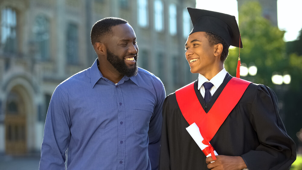 Dad congratulating his son at graduation